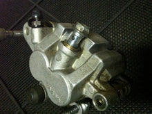 Load image into Gallery viewer, KAWASAKI KX250 KX 250 125 OEM COMPLETE FRONT BRAKE CALIPER MOUNT PADS BRAKES